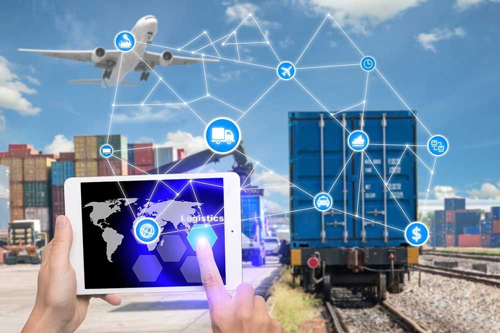 Person using tablet with logistics interface, airplane, shipping containers, and freight train in the background.